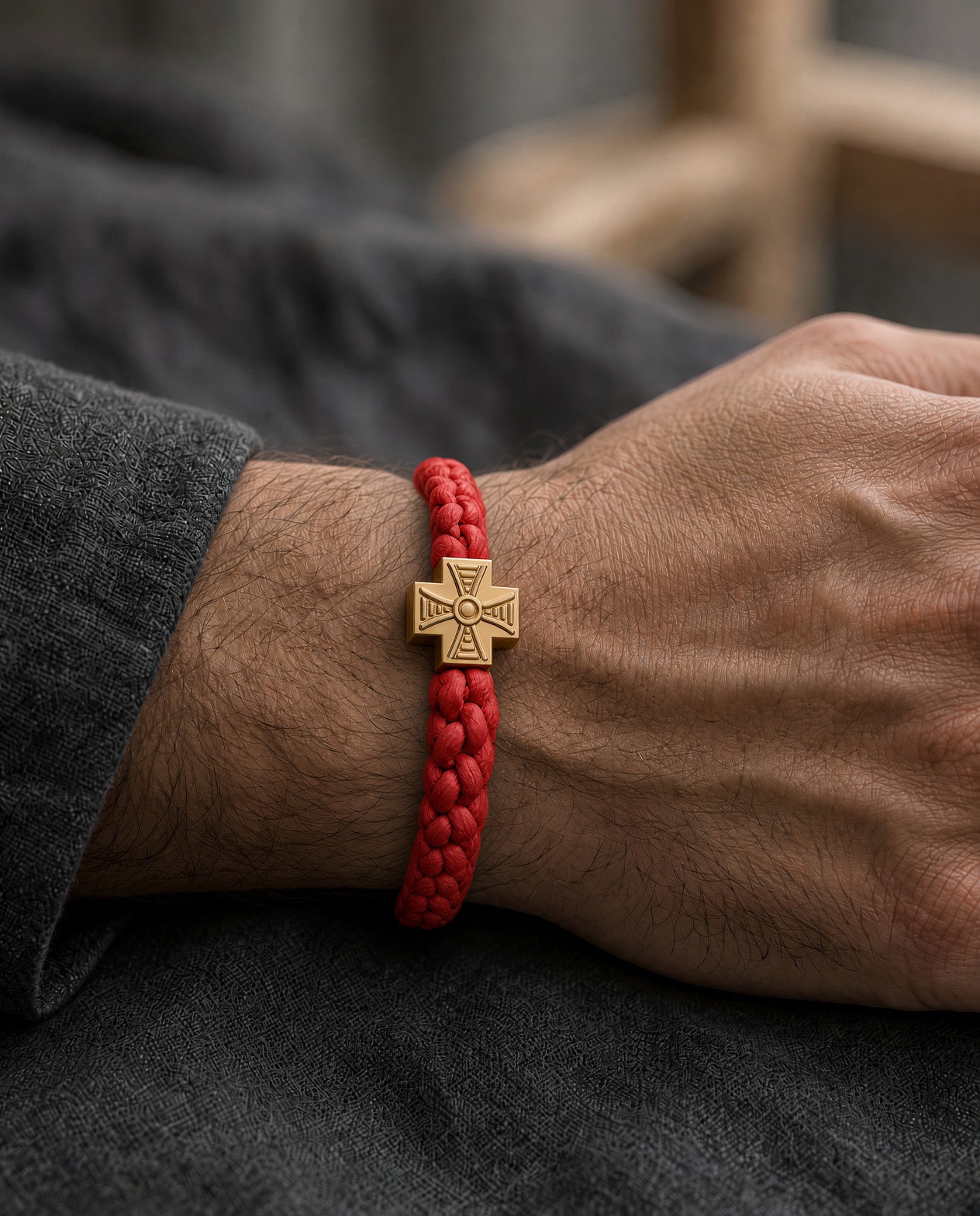 Red cord Brojanica 33 on the wrist — outdoor wear